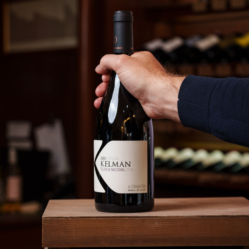 Benjamin Bridge sparkling wine being opened, showcasing a méthode classique rosé bottle in an elegant winery setting.