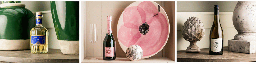 A curated selection of premium drinks for Mother's Day, featuring Seatrus Gin, Deutz Rosé Champagne, and Tar & Roses Pinot Grigio, elegantly displayed in a stylish setting.