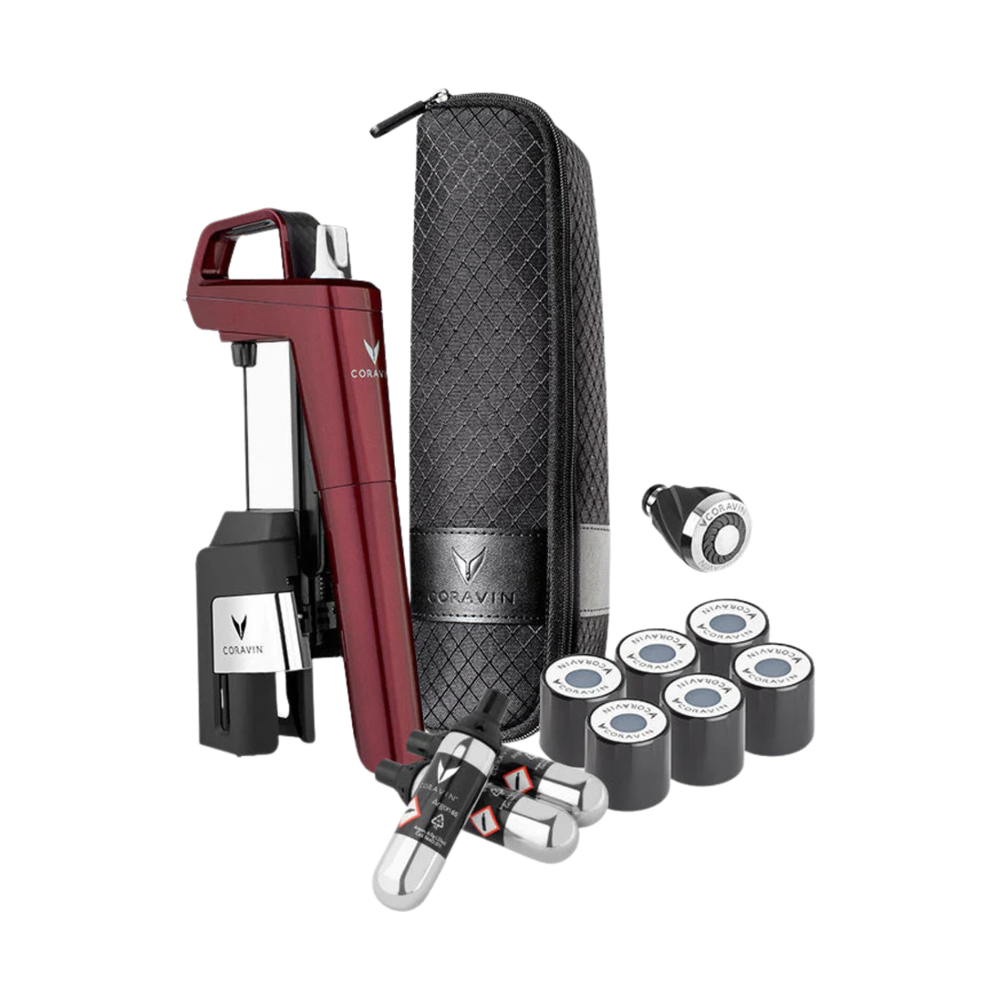 Coravin Timeless kit with wine bottle opener, carafes, and accessories on a white background