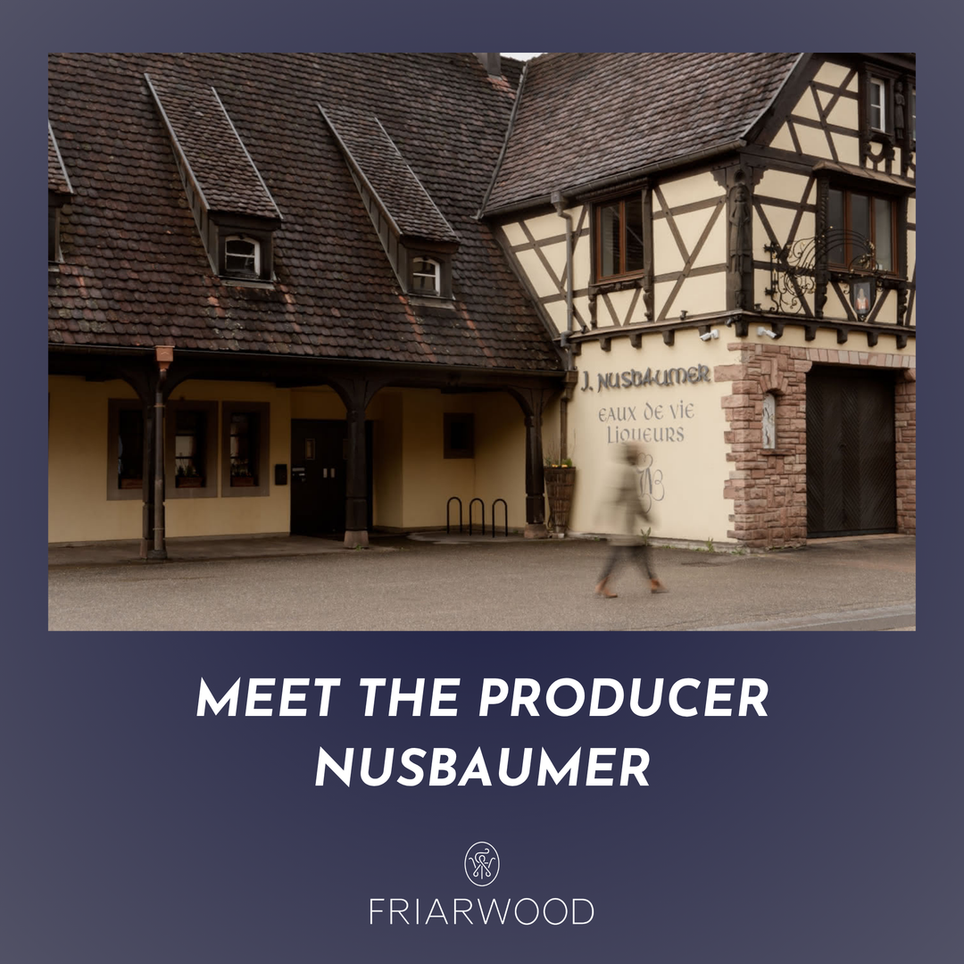 Traditional building with 'J. Nusbaumer' sign, text 'Meet the Producer Nusbaumer' and 'Friarwood' logo.